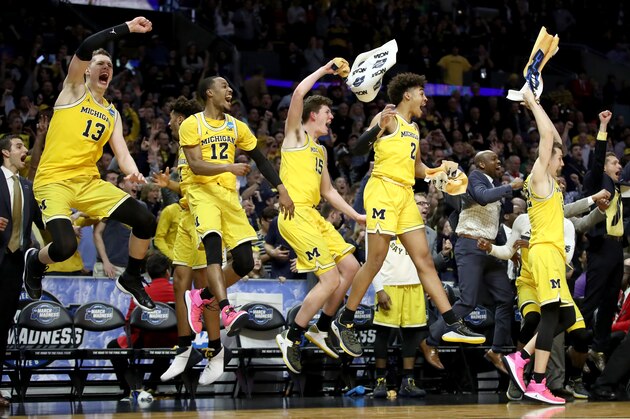 LOS ANGELES, CA - MARCH 22:  The Michigan Wolverines bench celebrates in the games final minutes against the Texas A&M Aggies in the 2018 NCAA Men's Basketball Tournament West Regional at Staples Center on March 22, 2018 in Los Angeles, California.  (Photo by Ezra Shaw/Getty Images)