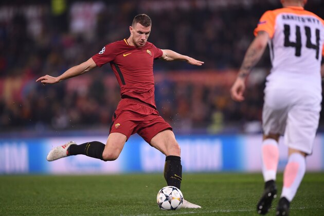 Roma's Bosnian striker Edin Dzeko kicks the ball during the UEFA Champions League round of 16 second leg football match AS Roma vs Shakhtar Donetsk on March 13, 2018 at the Olympic stadium in Rome.  / AFP PHOTO / Filippo MONTEFORTE        (Photo credit should read FILIPPO MONTEFORTE/AFP/Getty Images)
