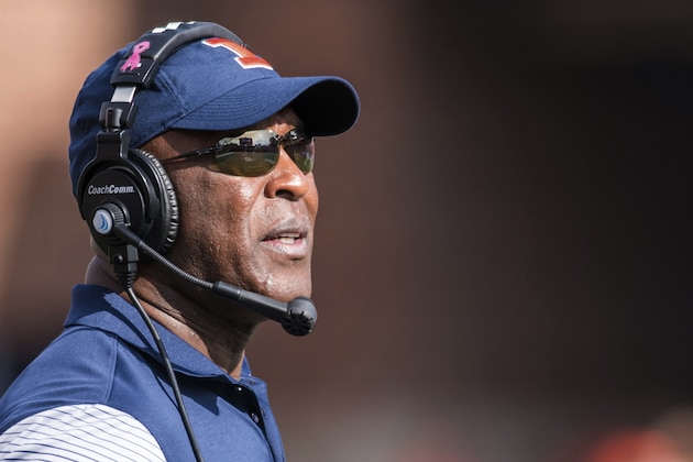 FILE - In this Oct. 29, 2016 file photo, Illinois head coach Lovie Smith looks at the scoreboard during t an NCAA college football game against Minnesota, at Memorial Stadium in Champaign, Ill. As Smith begins his second season of rebuilding the Illinois football program, he is already sure about two things. Junior Chayce Crouch will be his starting quarterback and senior Kendrick Foster will be the team's primary running back. The season opener comes at home on Sept. 2 against Ball State.(AP Photo/Bradley Leeb File)