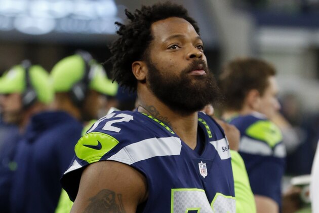 Seattle Seahawks defensive end Michael Bennett (72) watches his team play the Dallas Cowboys during an NFL football game, Sunday, Dec. 24, 2017, in Arlington, Texas. (AP Photo/Michael Ainsworth)