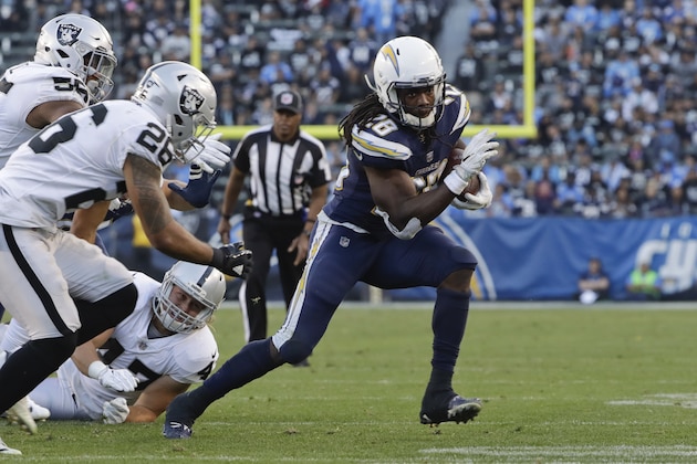 Los Angeles Chargers running back Melvin Gordon runs upfield during the second half of an NFL football game against the Oakland Raiders, Sunday, Dec. 31, 2017, in Carson, Calif. (AP Photo/Alex Gallardo)