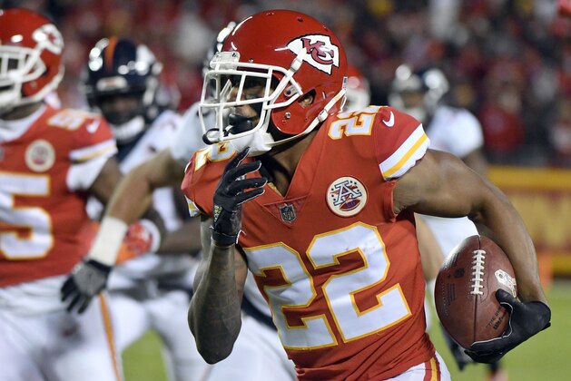 Kansas City Chiefs defensive back Marcus Peters (22) carries ball he stripped from Denver Broncos running back Jamaal Charles, during the first half of an NFL football game in Kansas City, Mo., Monday, Oct. 30, 2017. Peters recovered the ball and ran for a touchdown. (AP Photo/Ed Zurga)