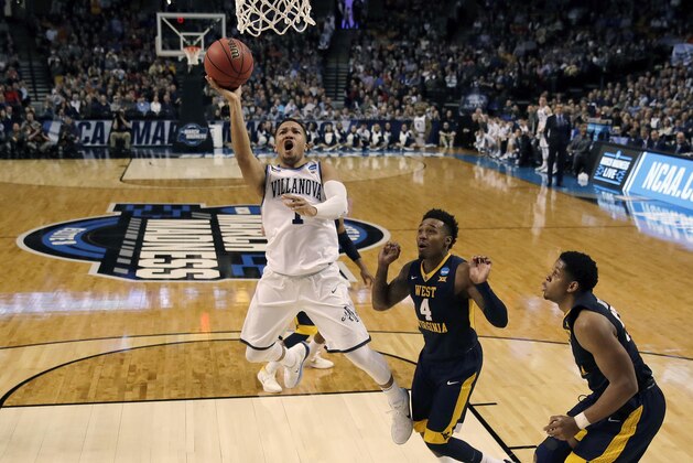 Villanova's Jalen Brunson drives to the basket past West Virginia's Daxter Miles Jr. (4) during the first half of an NCAA men's college basketball tournament regional semifinal Friday, March 23, 2018, in Boston. (AP Photo/Charles Krupa)
