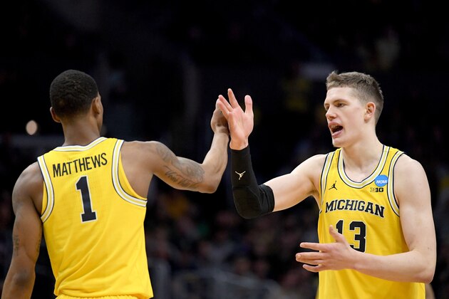 LOS ANGELES, CA - MARCH 22:  Moritz Wagner #13 and Charles Matthews #1 of the Michigan Wolverines celebrate in the second half while taking on the Texas A&M Aggies in the 2018 NCAA Men's Basketball Tournament West Regional at Staples Center on March 22, 2018 in Los Angeles, California.  (Photo by Harry How/Getty Images)
