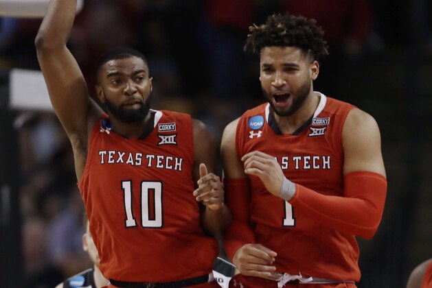 Texas Tech's Niem Stevenson, left, and Brandone Francis celebrate during the second half of the team's NCAA men's college basketball tournament regional semifinal against Purdue, Friday, March 23, 2018, in Boston. (AP Photo/Charles Krupa)