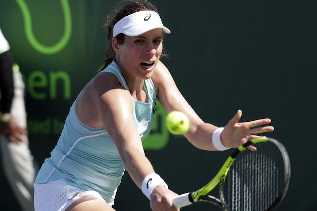 Johanna Konta, of Britain, returns to Kirsten Flipkens, of Belgium, during the Miami Open tennis tournament, Friday, March 23, 2018, in Key Biscayne, Fla. (AP Photo/Lynne Sladky)