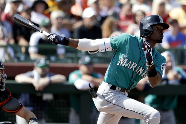 Seattle Mariners' Dee Gordon watches his two run home run against the San Francisco Giants during the third inning of a spring baseball game in Scottsdale, Ariz., Friday, March 9, 2018. (AP Photo/Chris Carlson)