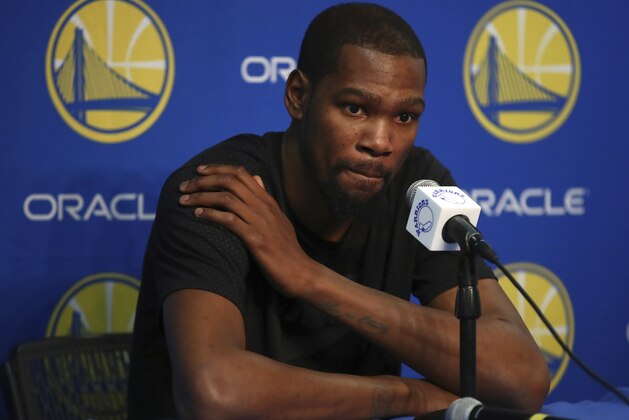 Golden State Warriors' Kevin Durant speaks during a media conference on Friday, March 16, 2018, in Oakland, Calif. Durant will miss 1-2 weeks to allow a rib injury to heal. (AP Photo/Ben Margot)