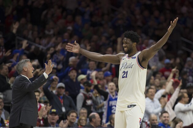PHILADELPHIA, PA - MARCH 2: Head coach Brett Brown of the Philadelphia 76ers celebrates with Joel Embiid #21 in the fourth quarter against the Charlotte Hornets at the Wells Fargo Center on March 2, 2018 in Philadelphia, Pennsylvania. The 76ers defeated the Hornets 110-99. NOTE TO USER: User expressly acknowledges and agrees that, by downloading and or using this photograph, User is consenting to the terms and conditions of the Getty Images License Agreement. (Photo by Mitchell Leff/Getty Images)