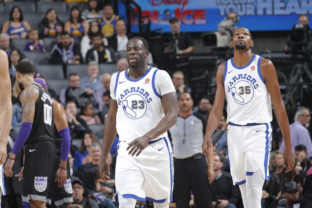 SACRAMENTO, CA - FEBRUARY 2: Draymond Green #23 and Kevin Durant #35 of the Golden State Warriors look on during the game againstthe Sacramento Kings on February 2, 2018 at Golden 1 Center in Sacramento, California. NOTE TO USER: User expressly acknowledges and agrees that, by downloading and or using this photograph, User is consenting to the terms and conditions of the Getty Images Agreement. Mandatory Copyright Notice: Copyright 2018 NBAE (Photo by Rocky Widner/NBAE via Getty Images)