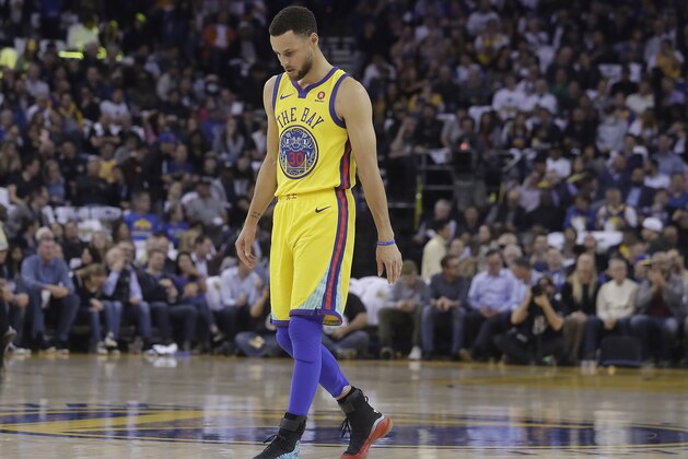 Golden State Warriors guard Stephen Curry (30) walks on the court to shoot free throws during the first half of an NBA basketball game against the San Antonio Spurs in Oakland, Calif., Thursday, March 8, 2018. (AP Photo/Jeff Chiu)