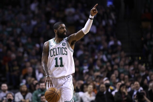Boston Celtics guard Kyrie Irving (11) calls to teammates during the first quarter of an NBA basketball game in Boston, Wednesday, Feb. 28, 2018. (AP Photo/Charles Krupa)