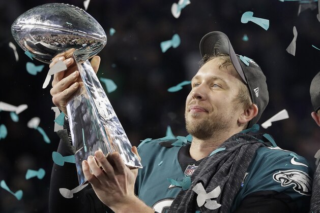 Philadelphia Eagles' Nick Foles holds up the Vince Lombardi Trophy after the NFL Super Bowl 52 football game against the New England Patriots, Sunday, Feb. 4, 2018, in Minneapolis. The Eagles won 41-33. (AP Photo/Matt Slocum)