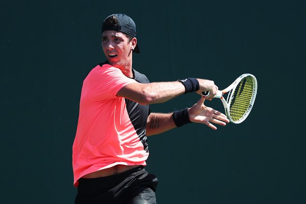 KEY BISCAYNE, FL - MARCH 20:  Thanasi Kokkinakis of Australia plays a shot against Daniel Taro of Japan during Day 2 of the Miami Open at the Crandon Park Tennis Center on March 19, 2018 in Key Biscayne, Florida.  (Photo by Al Bello/Getty Images)