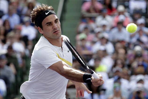 Roger Federer, of Switzerland, returns to Thanasi Kokkinakis, of Australia, during the Miami Open tennis tournament, Saturday, March 24, 2018, in Key Biscayne, Fla. (AP Photo/Lynne Sladky)