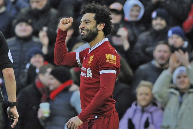 Liverpool's Mohamed Salah celebrates scoring his side's second goal of the game against West Ham, during the English Premier League soccer match between Liverpool and West Ham United at Anfield in Liverpool, England, Saturday, Feb. 24, 2018. (AP Photo/Rui Vieira)
