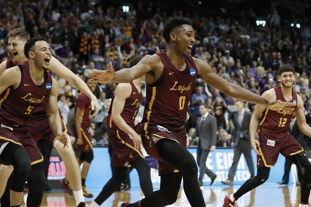 Loyola-Chicago players celebrate after winning a regional final NCAA college basketball tournament game against Kansas State, Saturday, March 24, 2018, in Atlanta. Loyola-Chicago won 78-62. (AP Photo/David Goldman)