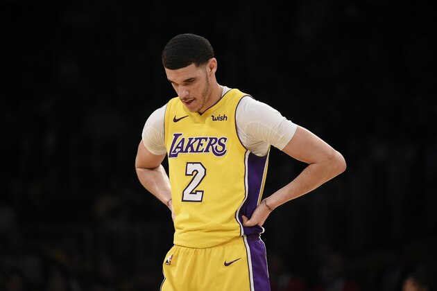 Los Angeles Lakers guard Lonzo Ball looks on during the first half of an NBA basketball game against the Denver Nuggets in Los Angeles, Tuesday, March 13, 2018. (AP Photo/Kelvin Kuo)