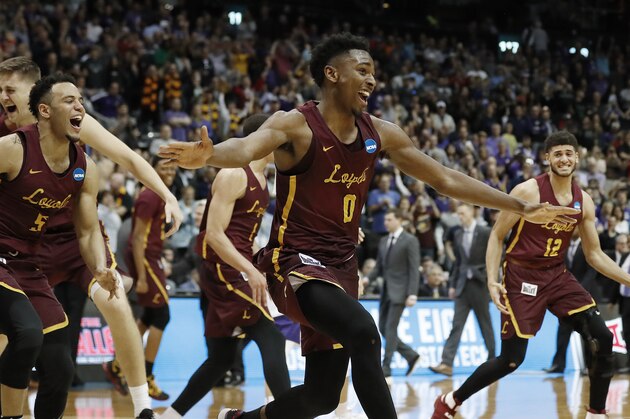 Loyola-Chicago players celebrate after winning a regional final NCAA college basketball tournament game against Kansas State, Saturday, March 24, 2018, in Atlanta. Loyola-Chicago won 78-62. (AP Photo/David Goldman)