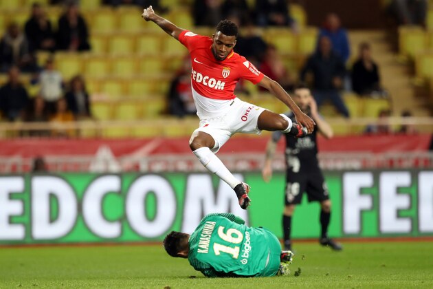 Monaco's French midfielder Thomas Lemar (top) vies with Metz' Japanese goalkeeper Eiji Kawashima during the French L1 football match Monaco versus Metz on January 21, 2018 at the Louis II Stadium in Monaco.   / AFP PHOTO / VALERY HACHE        (Photo credit should read VALERY HACHE/AFP/Getty Images)