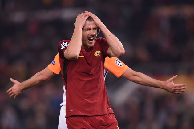 Roma's Bosnian striker Edin Dzeko reacts during the UEFA Champions League round of 16 second leg football match AS Roma vs Shakhtar Donetsk on March 13, 2018 at the Olympic stadium in Rome.  / AFP PHOTO / Filippo MONTEFORTE        (Photo credit should read FILIPPO MONTEFORTE/AFP/Getty Images)