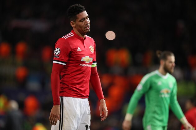 MANCHESTER, ENGLAND - MARCH 13: A dejected Chris Smalling of Manchester United during the UEFA Champions League Round of 16 Second Leg match between Manchester United and Sevilla FC at Old Trafford on March 13, 2018 in Manchester, United Kingdom. (Photo by Matthew Ashton - AMA/Getty Images)