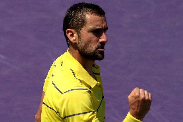 KEY BISCAYNE, FL - MARCH 25:  Marin Cilic of Croatia celebrates winning the first set against Vasek Pospisil of Canada during the Miami Open Presented by Itau at Crandon Park Tennis Center  on March 25, 2018 in Key Biscayne, Florida.  (Photo by Matthew Stockman/Getty Images)