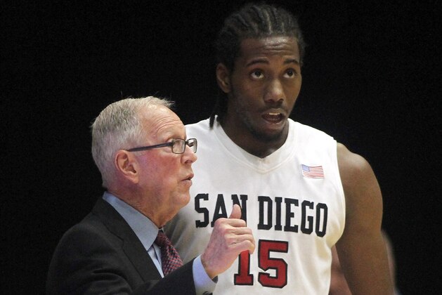 San Diego State head coach Steve Fisher talks with Kawhi Leonard during the first half of an NCAA college basketball a game against Green Bay. Saturday, Nov. 20, 2010, in Oxford, Ohio. (AP Photo/Tony Tribble)