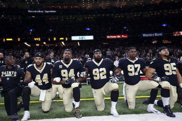 New Orleans Saints players kneel before the National Anthem before an NFL football game against the New York Jets in New Orleans, Sunday, Dec. 17, 2017. The players stood for the anthem. (AP Photo/Gerald Herbert)