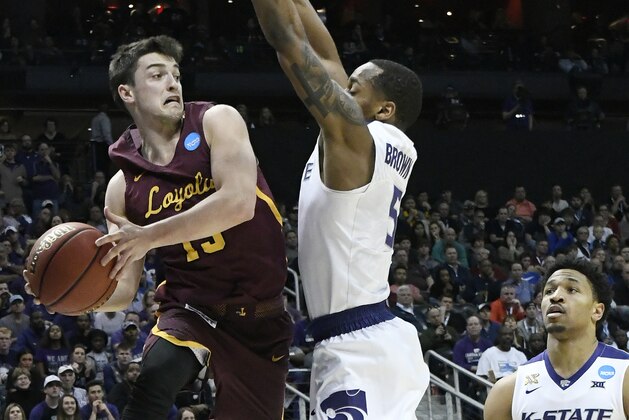 Loyola-Chicago guard Clayton Custer (13) looks to pass against Kansas State guard Barry Brown (5) during the first half of a regional final NCAA college basketball tournament game, Saturday, March 24, 2018, in Atlanta. (AP Photo/John Amis)