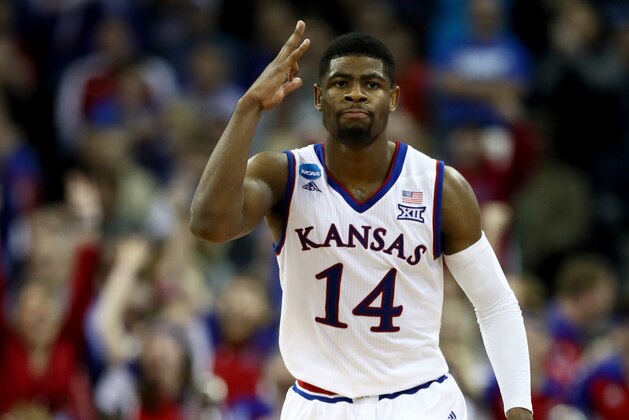 OMAHA, NE - MARCH 25:  Malik Newman #14 of the Kansas Jayhawks celebrates against the Duke Blue Devils during overtime in the 2018 NCAA Men's Basketball Tournament Midwest Regional at CenturyLink Center on March 25, 2018 in Omaha, Nebraska. The Kansas Jayhawks defeated the Duke Blue Devils 85-81.  (Photo by Jamie Squire/Getty Images)