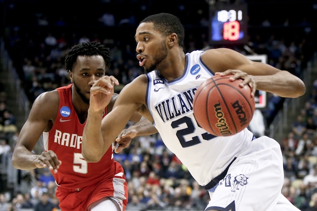 Villanova's Mikal Bridges (25) drives on Radford's Donald Hicks (5) during the second half of an NCAA men's college basketball tournament first-round game Thursday, March 15, 2018, in Pittsburgh. Villanova won 87-61. (AP Photo/Keith Srakocic)
