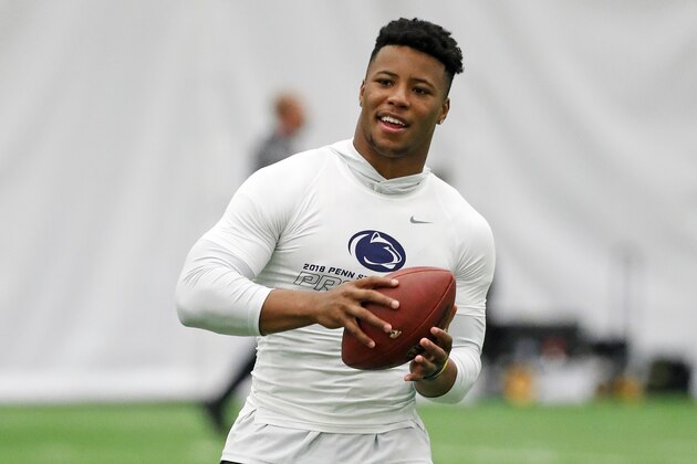 Penn State running back Saquon Barkley (26) catches a football during Penn State Pro Day in State College, Pa., Tuesday, March 20, 2018. Barkley did not participate in the drills. (AP Photo/Gene J. Puskar)