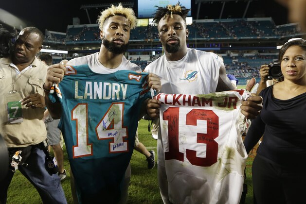 Miami Dolphins wide receiver Jarvis Landry (14) and New York Giants wide receiver Odell Beckham (13) exchange jerseys at the end an NFL football game, Monday, Dec. 14, 2015, in Miami Gardens, Fla. The Giants defeated the Dolphins 31-24. (AP Photo/Lynne Sladky)