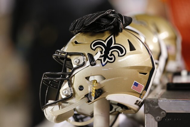 A New Orleans Saints helmet sits on the bench during the first half of an NFL preseason football game against the Cleveland Browns, Thursday, Aug. 10, 2017, in Cleveland. (AP Photo/Ron Schwane)