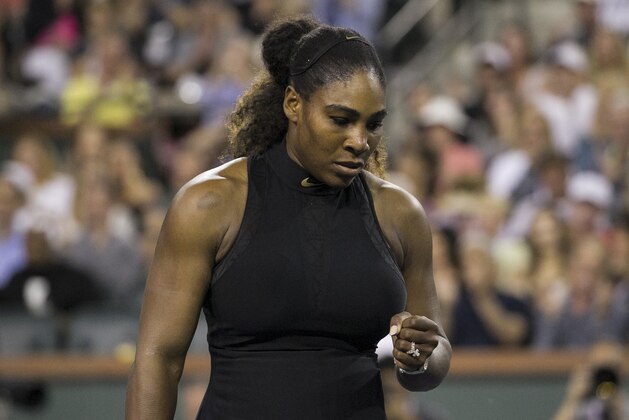 Serena Williams pumps her fist while playing opponent and sister Venus Williams during the third round of the BNP Paribas Open tennis tournament at the Indian Wells Tennis Garden in Indian Wells, Calif., Monday, March 12, 2018. (AP Photo/Crystal Chatham)