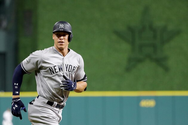 HOUSTON, TX - OCTOBER 20:  Aaron Judge #99 of the New York Yankees celebrates after hitting a solo home run against Brad Peacock #41 of the Houston Astros during the eighth inning in Game Six of the American League Championship Series at Minute Maid Park on October 20, 2017 in Houston, Texas.  (Photo by Elsa/Getty Images)