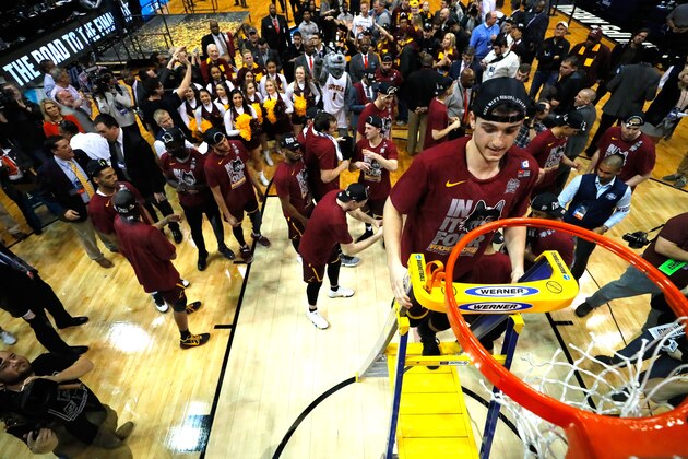 ATLANTA, GA - MARCH 24:  Clayton Custer #13 of the Loyola Ramblers celebrates by cutting down the net after defeating the Kansas State Wildcats during the 2018 NCAA Men's Basketball Tournament South Regional at Philips Arena on March 24, 2018 in Atlanta, Georgia. Loyola defeated Kansas State 78-62 to advance to the Final Four.  (Photo by Ronald Martinez/Getty Images)