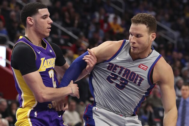 Detroit Pistons forward Blake Griffin (23) attempts to drive around Los Angeles Lakers guard Lonzo Ball (2) during the first half of an NBA basketball game, Monday, March 26, 2018, in Detroit. (AP Photo/Carlos Osorio)
