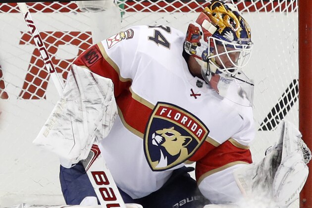 Florida Panthers goaltender James Reimer (34) makes a glove save during the third period of an NHL hockey game against the New York Islanders in New York, Monday, March 26, 2018. The Panthers shut out the Islanders 3-0. (AP Photo/Kathy Willens)