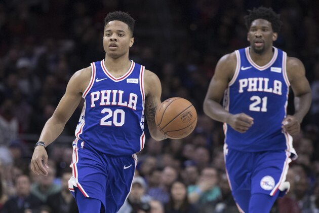 PHILADELPHIA, PA - MARCH 26: Markelle Fultz #20 of the Philadelphia 76ers dribbles the ball up the court with Joel Embiid #21 trailing him in the first quarter against the Denver Nuggets at the Wells Fargo Center on March 26, 2018 in Philadelphia, Pennsylvania. NOTE TO USER: User expressly acknowledges and agrees that, by downloading and or using this photograph, User is consenting to the terms and conditions of the Getty Images License Agreement. (Photo by Mitchell Leff/Getty Images)
