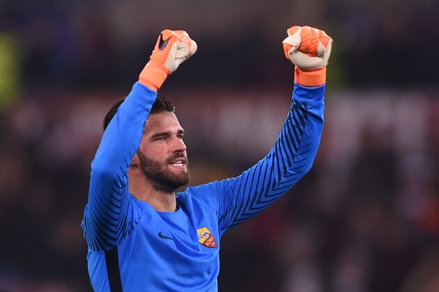 Roma's Brazilian goalkeeper Alisson celebrates afer winning 1-0 the UEFA Champions League round of 16 second leg football match AS Roma vs Shakhtar Donetsk on March 13, 2018 at the Olympic stadium in Rome. 
Roma reached the Champions League quarter-finals for the first time in 10 years as Edin Dzeko edged them past Shakhtar Donetsk 1-0 at the Stadio Olimpico on Tuesday for an away goals victory. / AFP PHOTO / Filippo MONTEFORTE        (Photo credit should read FILIPPO MONTEFORTE/AFP/Getty Images)