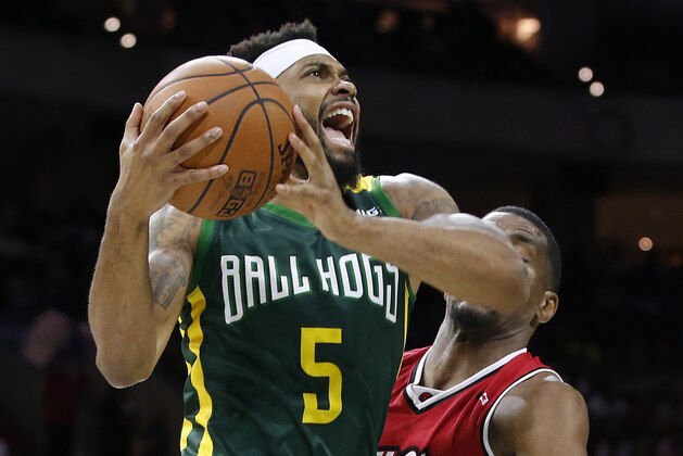 BallHogs' Xavier Silas (5) goes to the basket as Trilogy's James White (8) defends during Game 2 in the BIG3 Basketball League in Philadelphia, Pa., Sunday, July 16, 2017. (AP Photo/Rich Schultz)