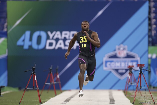 Georgia linebacker Roquan Smith runs the 40-yard dash at the NFL football scouting combine in Indianapolis, Sunday, March 4, 2018. (AP Photo/Michael Conroy)