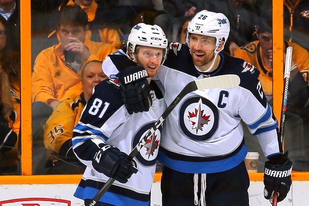 NASHVILLE, TN - MARCH 13:  Blake Wheeler #26 of the Winnipeg Jets congratulates teammate Kyle Connor #81 of the Winnipeg Jets on scoring a goal against the Nashville Predators during the third period of a 3-1 Predators victory at Bridgestone Arena on March 13, 2018 in Nashville, Tennessee.  (Photo by Frederick Breedon/Getty Images)