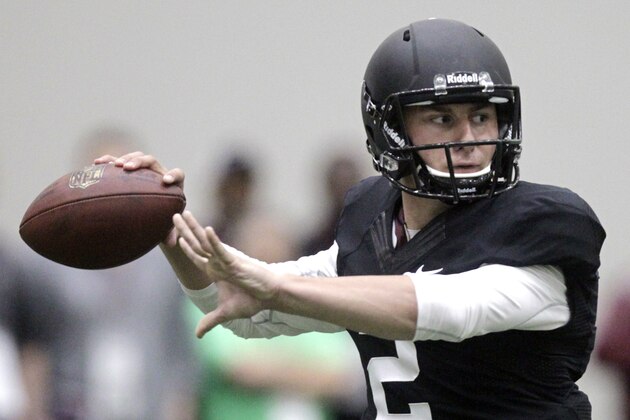 Texas A&M quarterback Johnny Manziel passes the ball during a drill at pro day for NFL football representatives in College Station, Texas, Thursday, March 27, 2014. (AP Photo/Patric Schneider)
