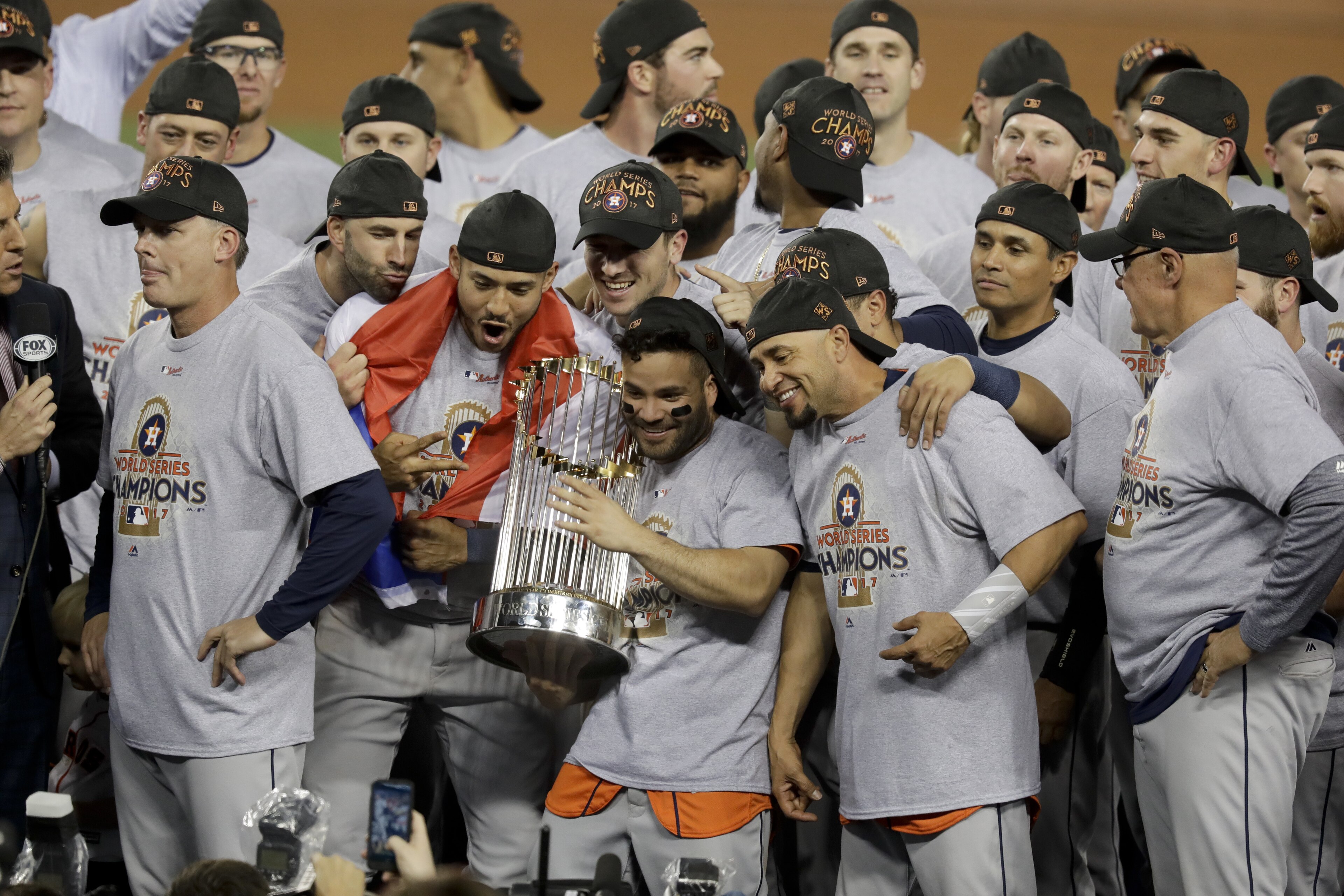The Houston Astros celebrate with the trophy after their win against the Los Angeles Dodgers in Game 7 of baseball's World Series Wednesday, Nov. 1, 2017, in Los Angeles. The Astros won 5-1 to win the series 4-3. (AP Photo/Alex Gallardo)