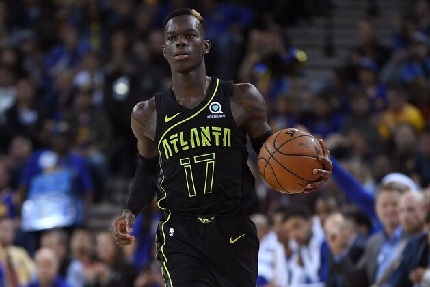 OAKLAND, CA - MARCH 23:  Dennis Schroder #17 of the Atlanta Hawks dribbles the ball against the Golden State Warriors during an NBA basketball game at ORACLE Arena on March 23, 2018 in Oakland, California. NOTE TO USER: User expressly acknowledges and agrees that, by downloading and or using this photograph, User is consenting to the terms and conditions of the Getty Images License Agreement.  (Photo by Thearon W. Henderson/Getty Images)