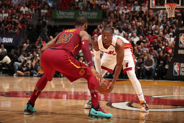 MIAMI, FL - MARCH 27: Dwyane Wade #3 of the Miami Heat handles the ball against LeBron James #23 of the Cleveland Cavaliers on March 27, 2018 at American Airlines Arena in Miami, Florida. NOTE TO USER: User expressly acknowledges and agrees that, by downloading and or using this Photograph, user is consenting to the terms and conditions of the Getty Images License Agreement. Mandatory Copyright Notice: Copyright 2018 NBAE (Photo by Issac Baldizon/NBAE via Getty Images)