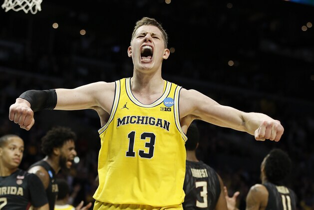 Michigan forward Moritz Wagner celebrates after scoring during the second half against Florida State in an NCAA men's college basketball tournament regional final, Saturday, March 24, 2018, in Los Angeles. (AP Photo/Alex Gallardo)